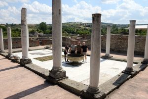 Four guys are posing in front of the columns of Felix Romuliana temple in East Serbia.