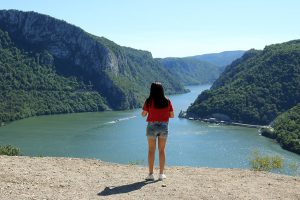 Woman in front of the Iron Gate gorge.