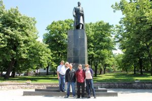 Group of tourists are posing in front of Karadjordje monument on their shared small group tour to Topola and Oplenac.