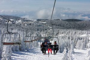 Skiers on ski lift at Kopaonik